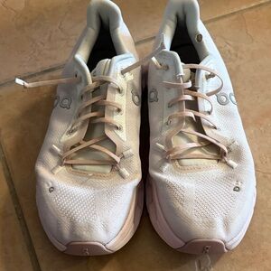 White and Pink Athletic Shoes